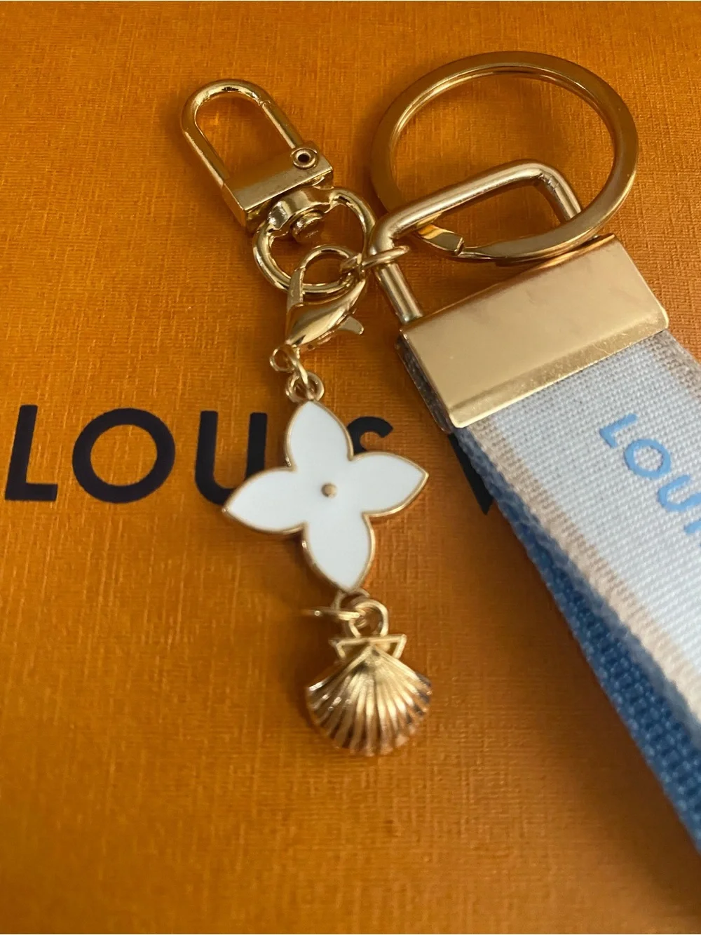 Louis Vuitton White and Light Blue Ribbon Keyring with Gold Hardware